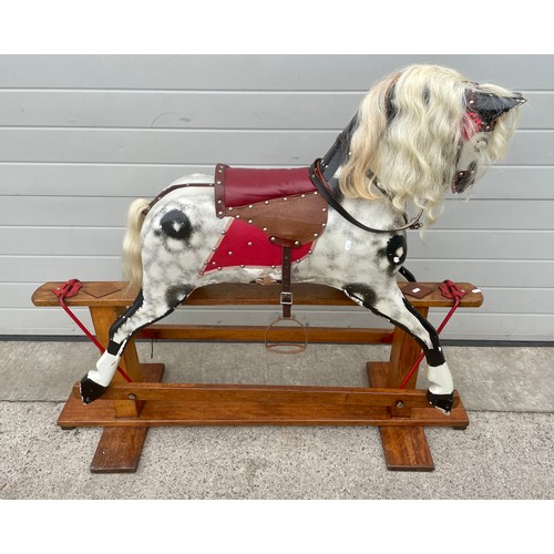 A large early 20thC rocking horse 120cm tall