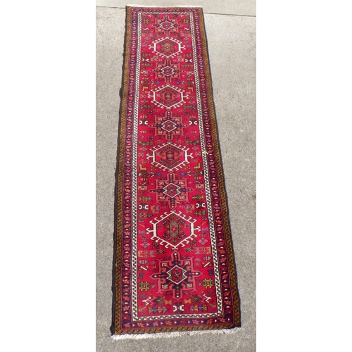 705 - A Persian Heriz style Runner 75 x 285cm