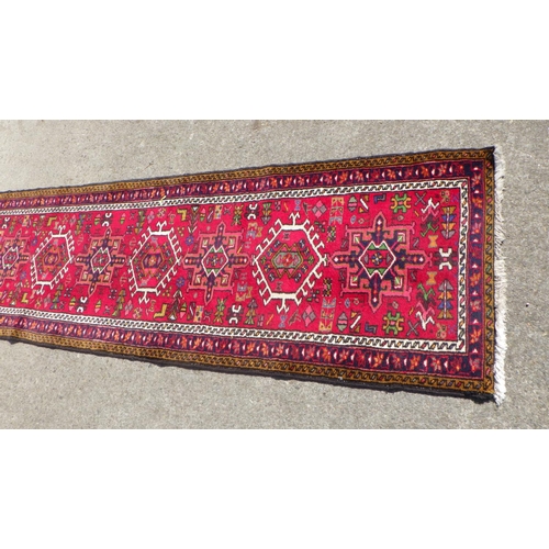 705 - A Persian Heriz style Runner 75 x 285cm