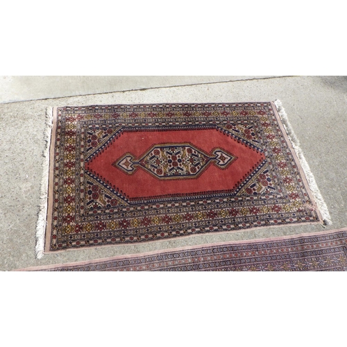 706 - A Pakistani style rug 100 x 160cm together with a further rug 125 x 200cm , moth damage (2)