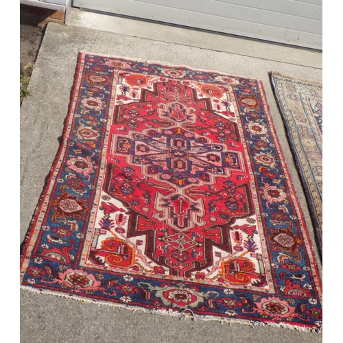 707 - A Turkish red ground rug together with a further Rug 135 x190 & 150 x 210cm (2)