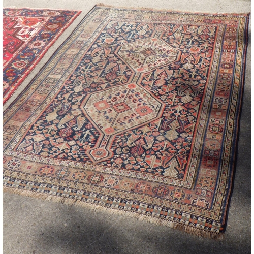 707 - A Turkish red ground rug together with a further Rug 135 x190 & 150 x 210cm (2)