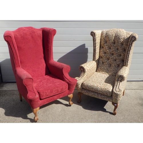 709 - Two wing back arm chairs with claw & ball feet