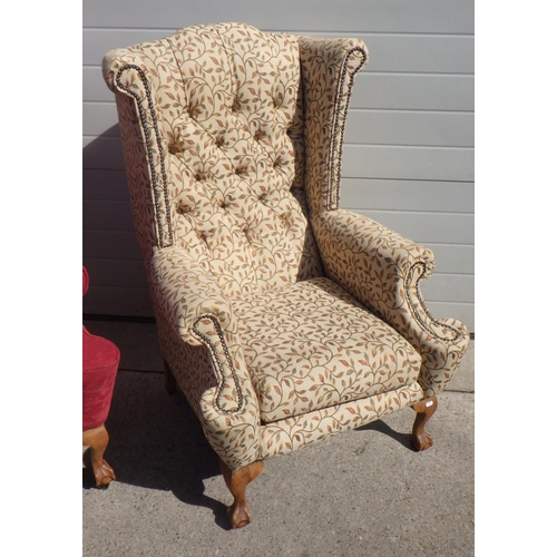 709 - Two wing back arm chairs with claw & ball feet