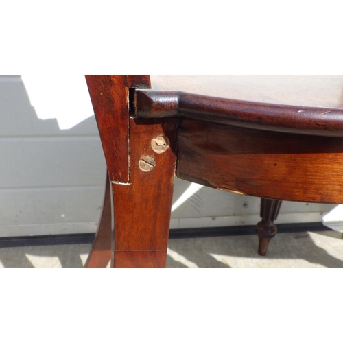 715 - A pair of Regency mahogany hall chairs on reeded legs, in the manner of Gillow a/f repairs, replaced... 