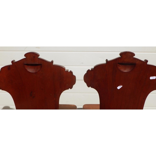 715 - A pair of Regency mahogany hall chairs on reeded legs, in the manner of Gillow a/f repairs, replaced... 