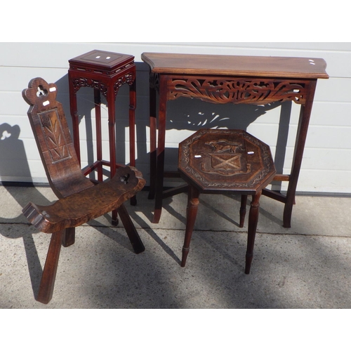 718 - An Oriental hardwood vase stand, carved top side table, hall table and a birthing chair (4)