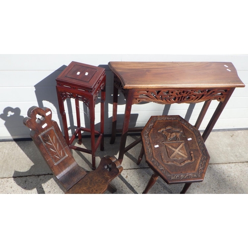 718 - An Oriental hardwood vase stand, carved top side table, hall table and a birthing chair (4)