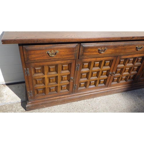 721 - A Toledo style oak sideboard, 207cm long