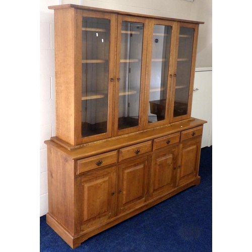 An oak, two section  four door bookcase, 183cm wide