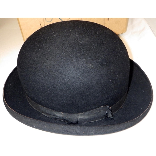 205 - A Royal Anglian officer's dress cap together with two top hats and a bowlers hat (4)