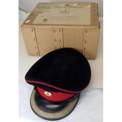 205 - A Royal Anglian officer's dress cap together with two top hats and a bowlers hat (4)