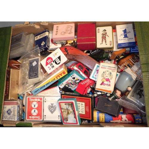 233 - Two boxes of misc dolls, playing cards etc (2)