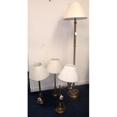 282 - A brass standard lamp together with a pair of brass table lamps and another (4)
All electricals sold... 