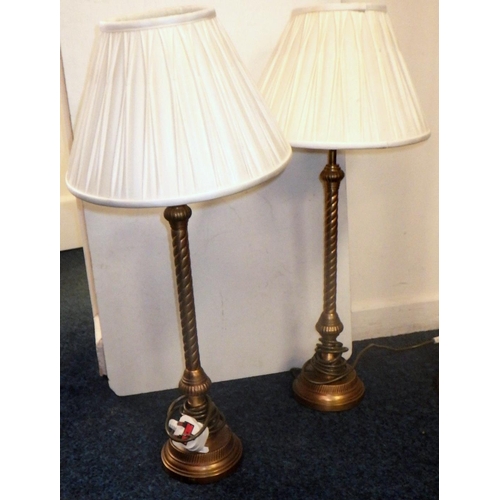 282 - A brass standard lamp together with a pair of brass table lamps and another (4)
All electricals sold... 