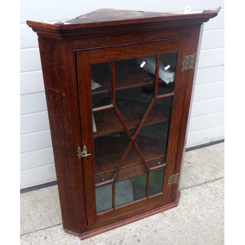 738 - A 19th cen hanging oak corner cabinet with astragal glazed door,  together with a set of curtains an... 