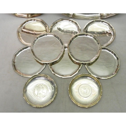 21 - Eight matching nut dishes, German white metal marked 835, each 100mm diameter; two German white meta... 