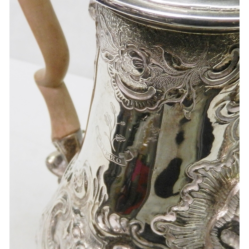 24 - A George II coffee pot of baluster form, chased and repousse decoration, John Langlands I, Newcastle... 