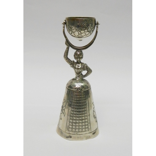 28 - A Wedding Wager Cup, white metal continental, possibly Austrian, 108mm tall; an Anglo-Indian condime... 