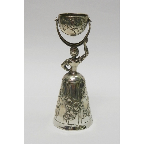 28 - A Wedding Wager Cup, white metal continental, possibly Austrian, 108mm tall; an Anglo-Indian condime... 