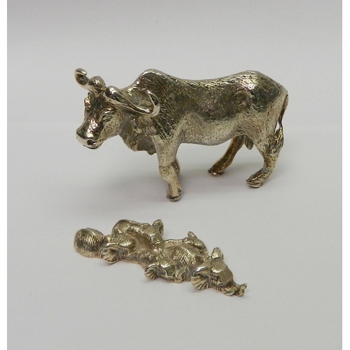 67 - Elephants moving through water, white metal miniature group by Patrick Mavros bearing Zimbabwe marks... 