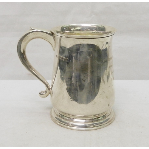 69 - A silver tankard, early 20th cent having presentation  engraving dated 1945.  A/F bruises.  128mm ta... 