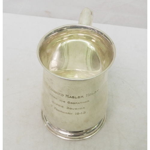 69 - A silver tankard, early 20th cent having presentation  engraving dated 1945.  A/F bruises.  128mm ta... 