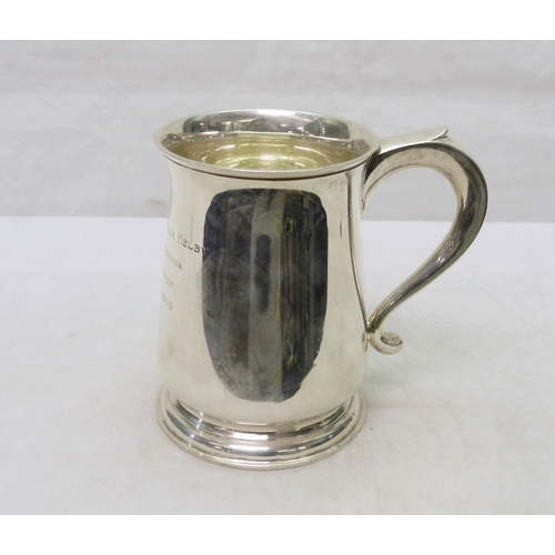 69 - A silver tankard, early 20th cent having presentation  engraving dated 1945.  A/F bruises.  128mm ta... 