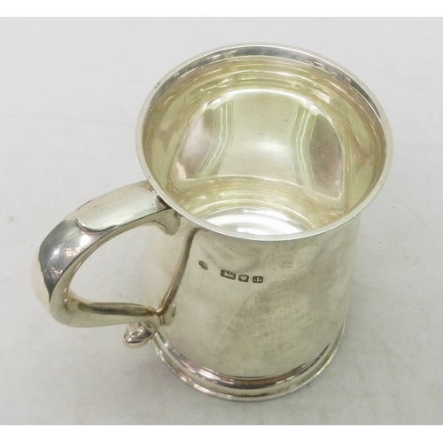 69 - A silver tankard, early 20th cent having presentation  engraving dated 1945.  A/F bruises.  128mm ta... 