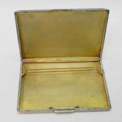 78 - A silver cigarette case having engine turned decoration to exterior, engraved with initials G St Q B... 