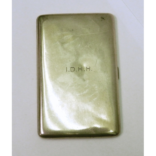 79 - A cigarette case having plain polished exterior, engraved with initials IDHH.  128 x 81mm / 200g