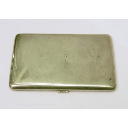 79 - A cigarette case having plain polished exterior, engraved with initials IDHH.  128 x 81mm / 200g