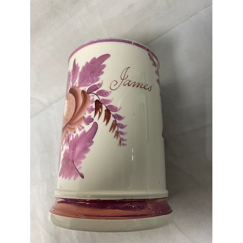 195 - A 19thC pink floral lustre creamware tankard “James” 13cm tall