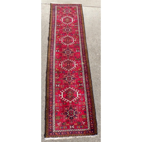 705 - A Persian Heriz style Runner 75 x 285cm