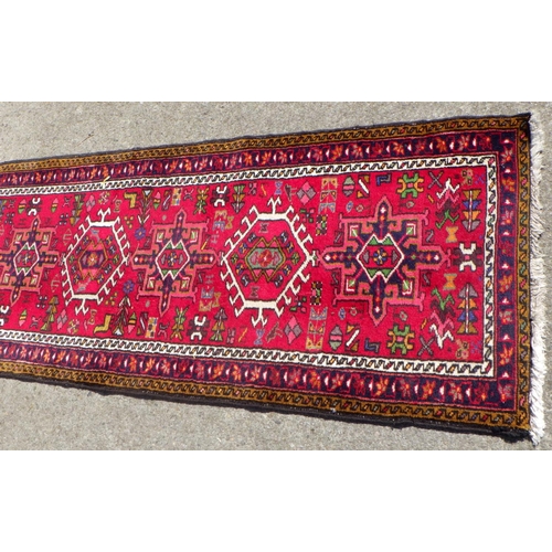 705 - A Persian Heriz style Runner 75 x 285cm