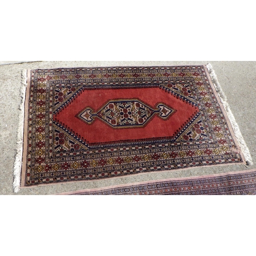 706 - A Pakistani style rug 100 x 160cm together with a further rug 125 x 200cm , moth damage (2)