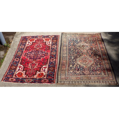 707 - A Turkish red ground rug together with a further Rug 135 x190 & 150 x 210cm (2)