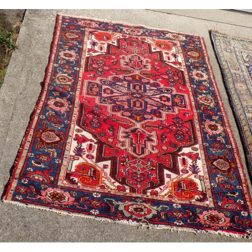 707 - A Turkish red ground rug together with a further Rug 135 x190 & 150 x 210cm (2)