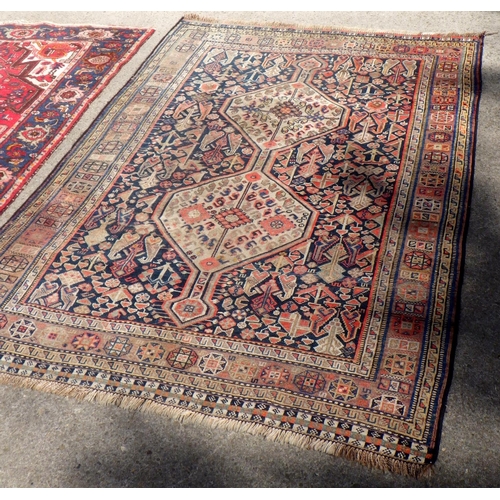 707 - A Turkish red ground rug together with a further Rug 135 x190 & 150 x 210cm (2)