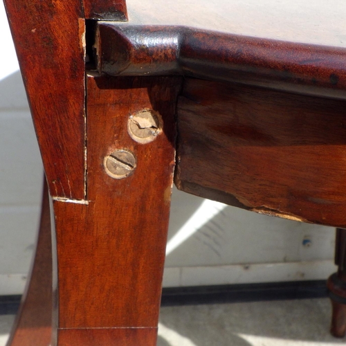 715 - A pair of Regency mahogany hall chairs on reeded legs, in the manner of Gillow a/f repairs, replaced... 