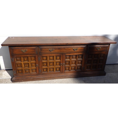 721 - A Toledo style oak sideboard, 207cm long