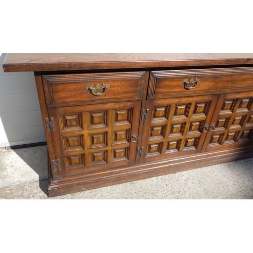 721 - A Toledo style oak sideboard, 207cm long