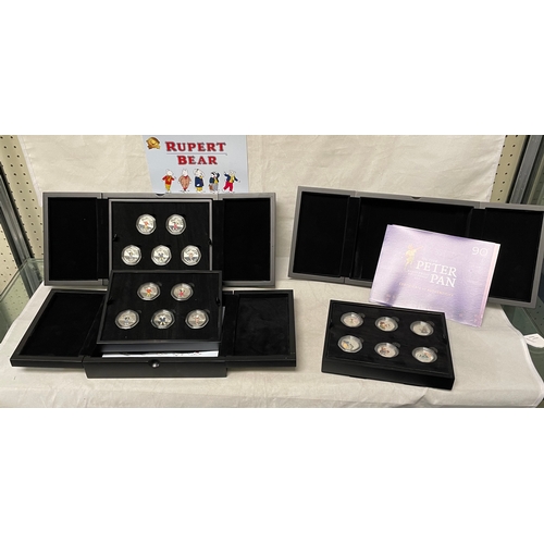 170 - Collectors Coins: Two silver proof Rupert 50p coin sets and a silver proof Peter Pan set