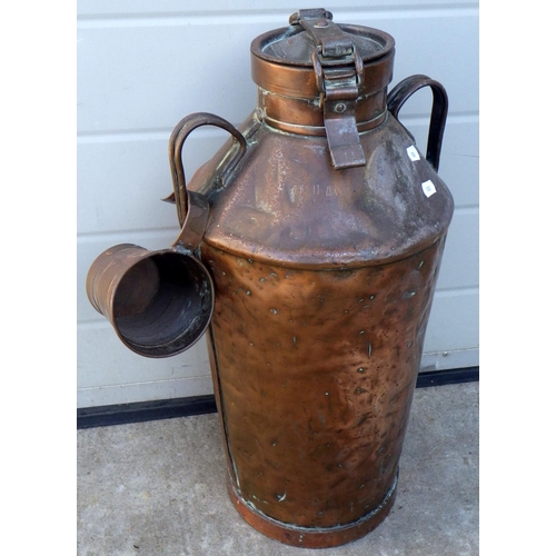 823 - A copper & steel water carrying vessel, with one cup, 56cm tall