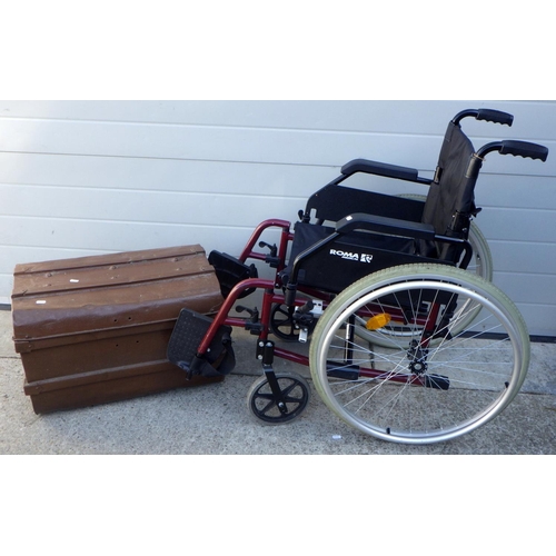 826 - A folding wheelchair, missing cushion together with a metal trunk (2)