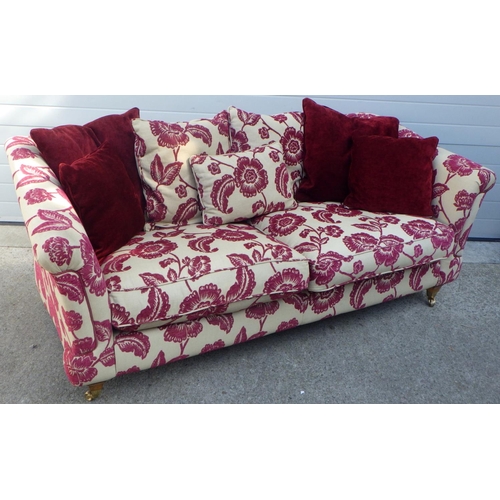 827 - A floral patterned sofa 210cm L 100cm D 80cm H