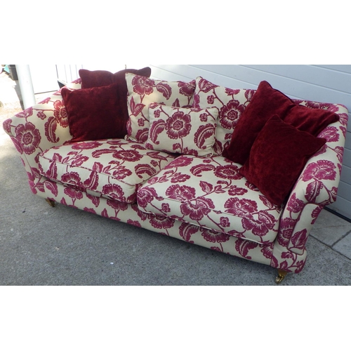 827 - A floral patterned sofa 210cm L 100cm D 80cm H