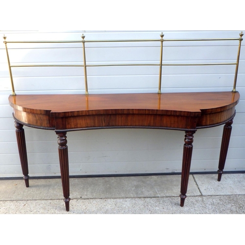 831 - A 19th cen mahogany serving table with brass gallery on reeded legs, some restoration, 199cm wide