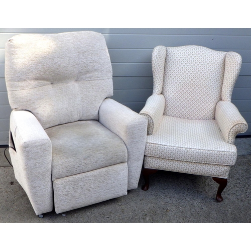 833 - An electric recliner chair together with a wingback chair, some marks (2)