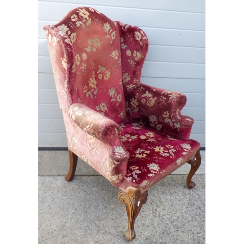 836 - A red upholstered wingback chair frame on cabriole legs